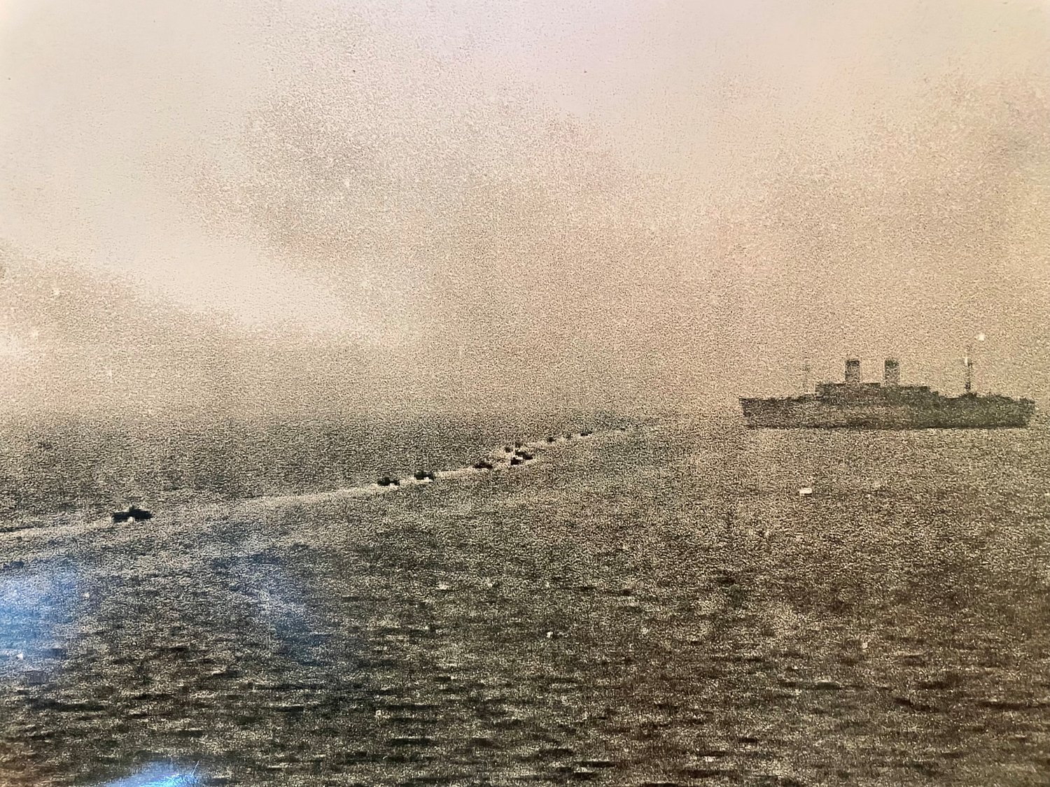 Landing craft can be seen transporting men to the USS General Black during the Korean War.